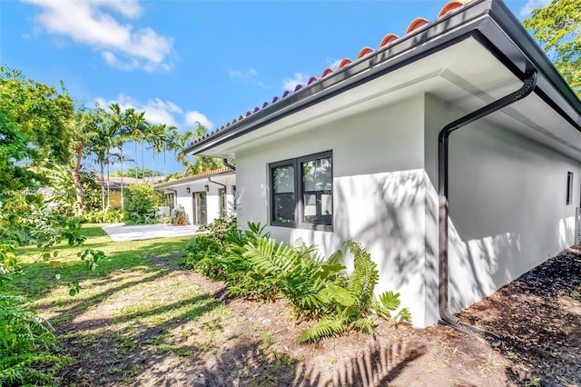 view of property exterior featuring a garage