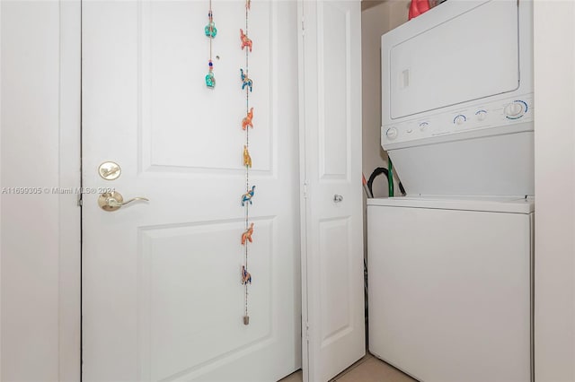 laundry area featuring stacked washing maching and dryer