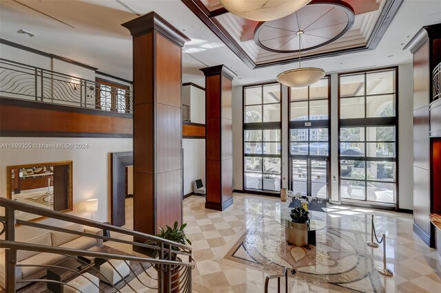 600 W Las Olas Blvd Unit 509S, Fort Lauderdale, FL 33312 - lobby featuring floor to ceiling windows, a towering ceiling, and crown molding