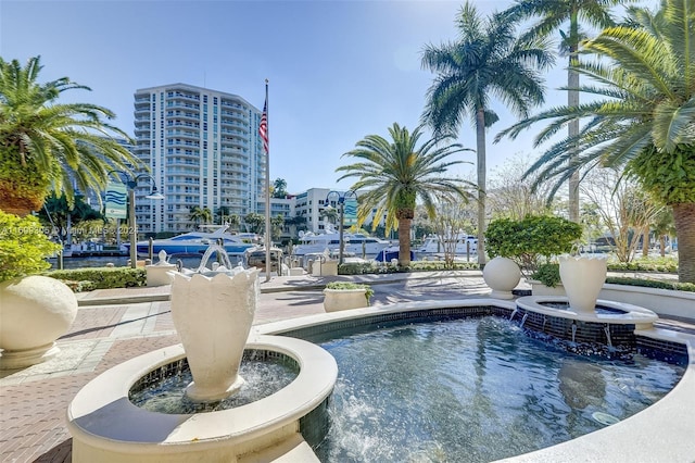 view of pool with pool water feature