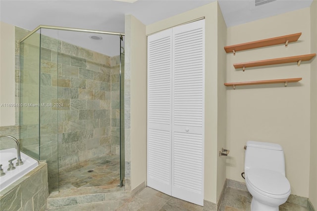 bathroom featuring plus walk in shower and toilet