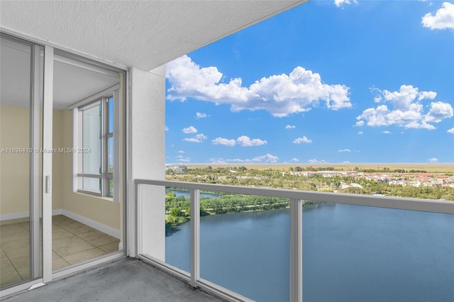 balcony featuring a water view