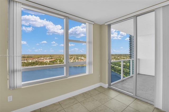 interior space with plenty of natural light and light tile patterned floors