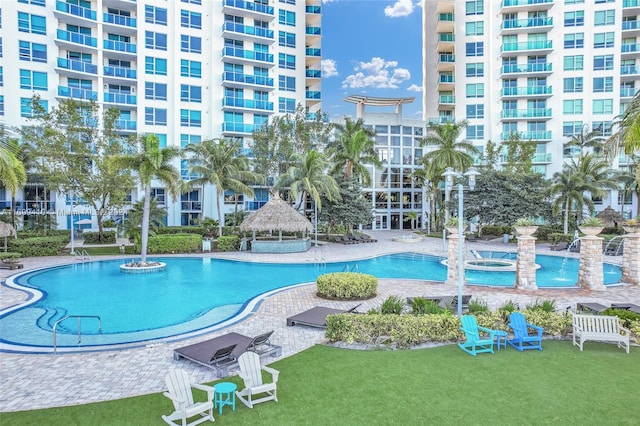 view of swimming pool with a gazebo, a patio, and a lawn