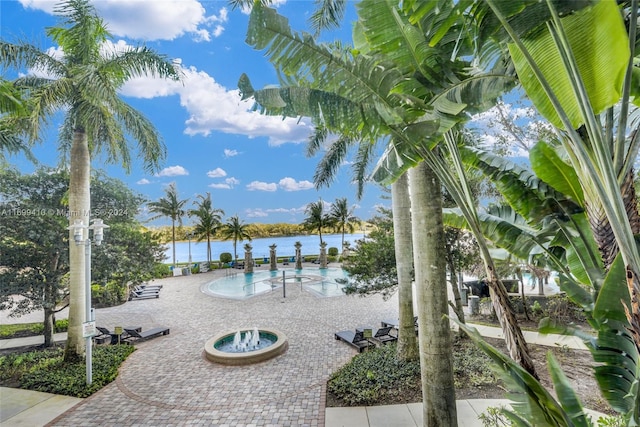 view of community featuring a water view and a pool