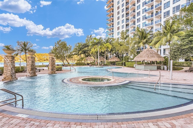 view of pool with a gazebo and pool water feature