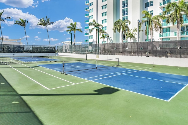 view of sport court with basketball hoop