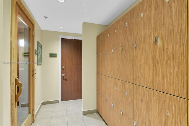 corridor featuring light tile patterned flooring