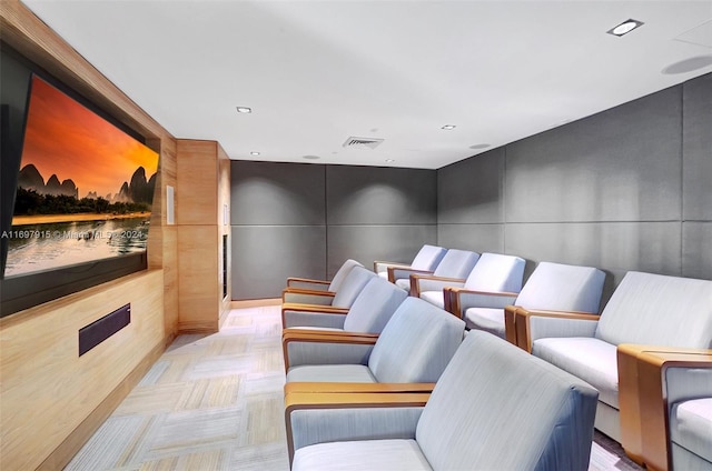 home theater room with light parquet floors