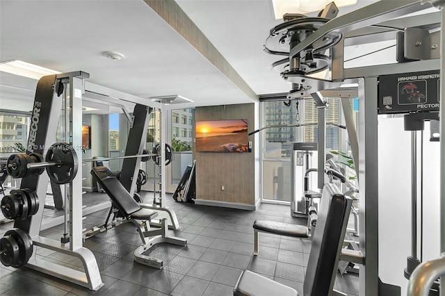 gym with a wall of windows