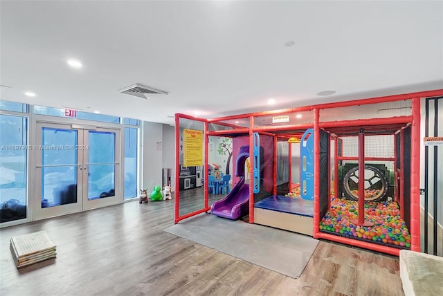 recreation room with hardwood / wood-style flooring