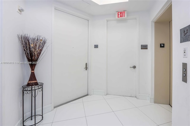 hall with light tile patterned flooring