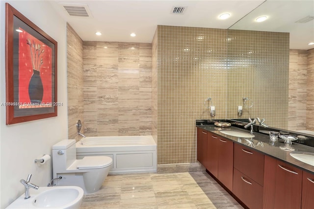 bathroom with vanity, a bidet, tile walls, toilet, and a bathing tub