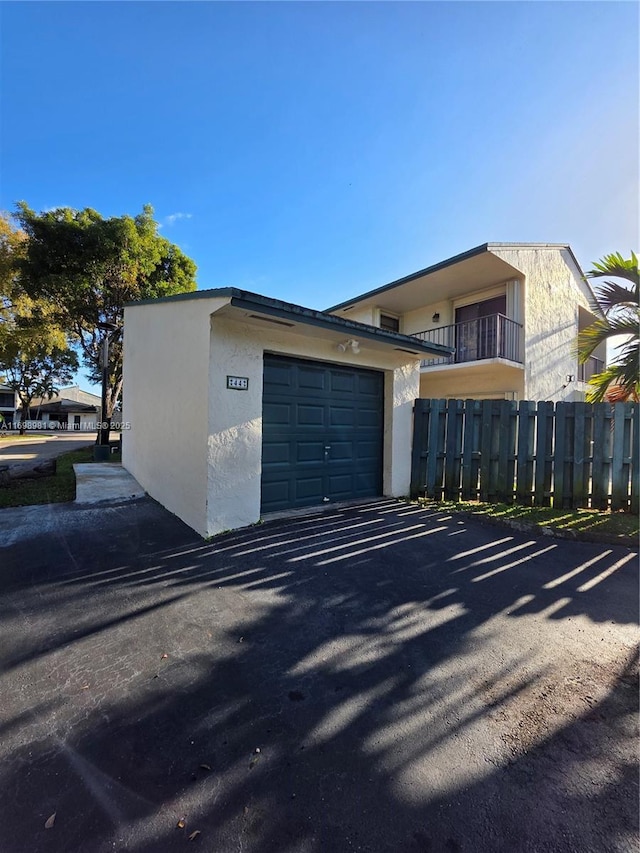 view of side of property with a garage