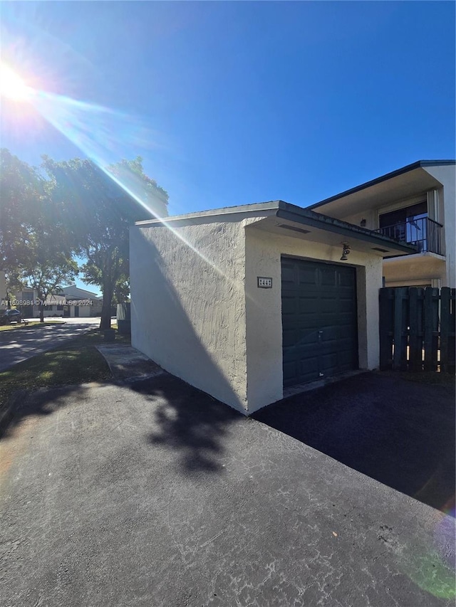 view of side of property featuring a garage