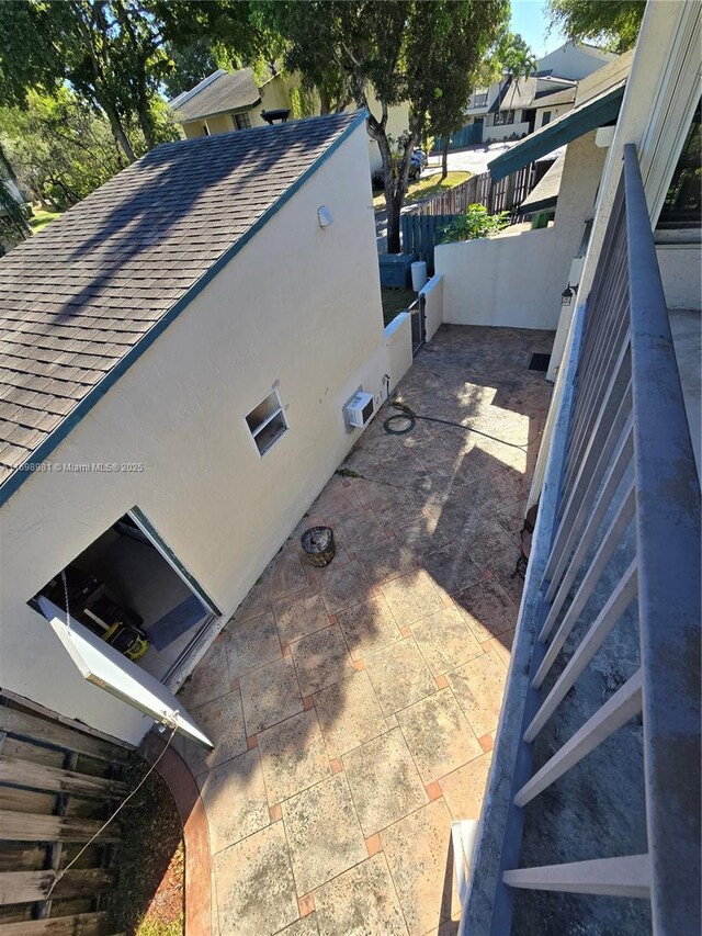 view of side of property with a patio area