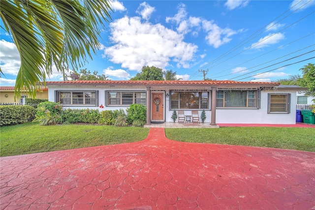 ranch-style home with a front yard