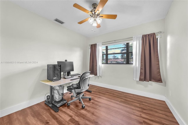 office with hardwood / wood-style flooring and ceiling fan