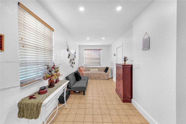 hall with light tile patterned flooring