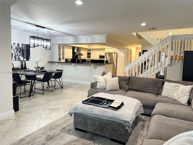 living room with light tile patterned flooring and ornamental molding