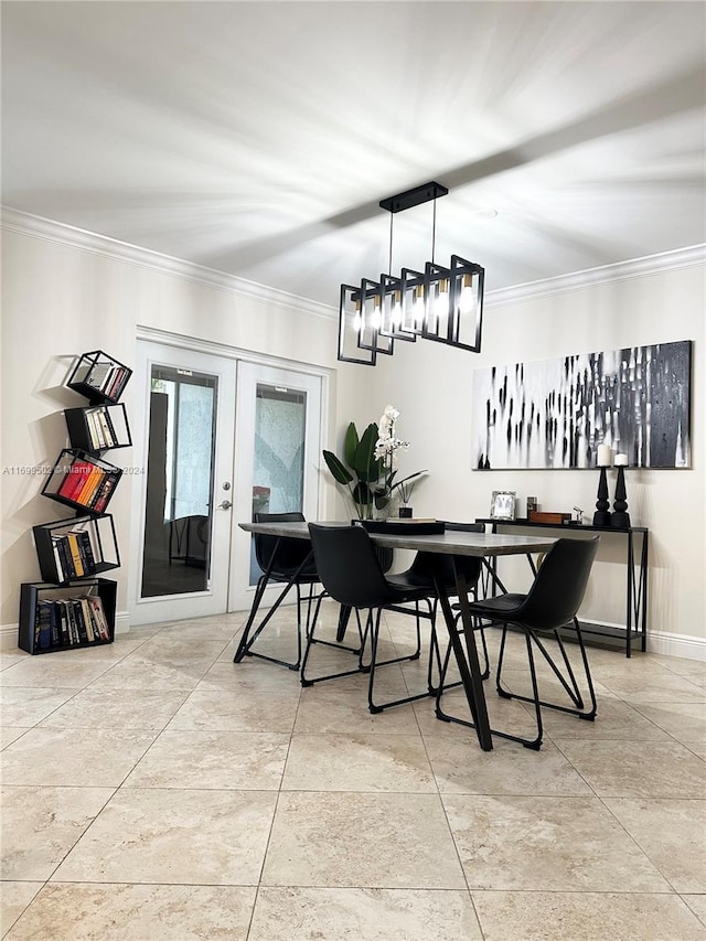 dining area with crown molding and french doors