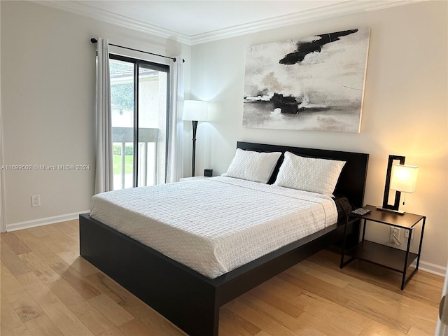 bedroom featuring crown molding and light hardwood / wood-style flooring