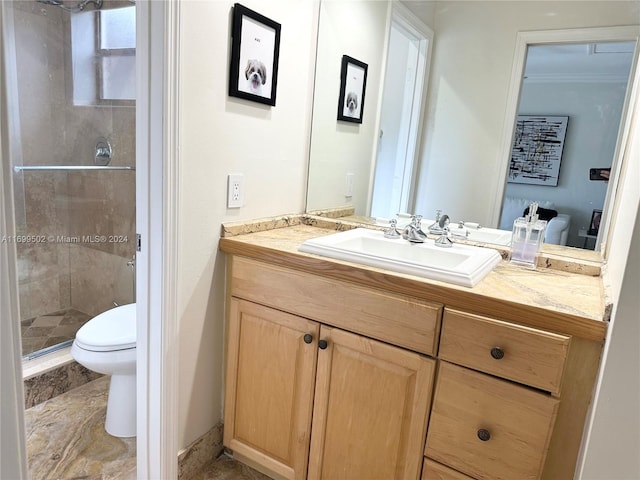 bathroom with walk in shower, vanity, ornamental molding, and toilet