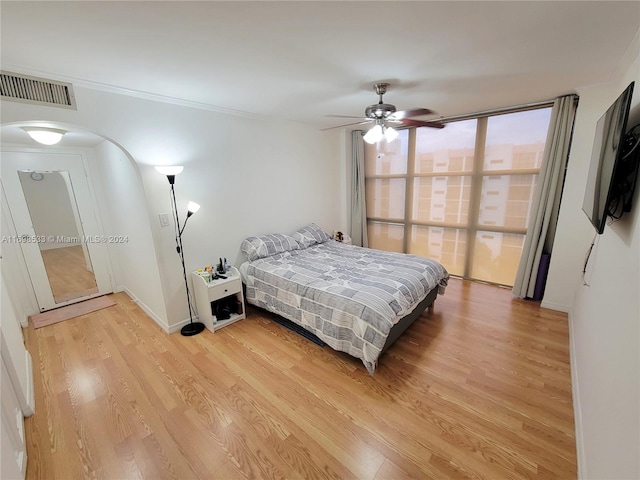 bedroom featuring ceiling fan and hardwood / wood-style floors