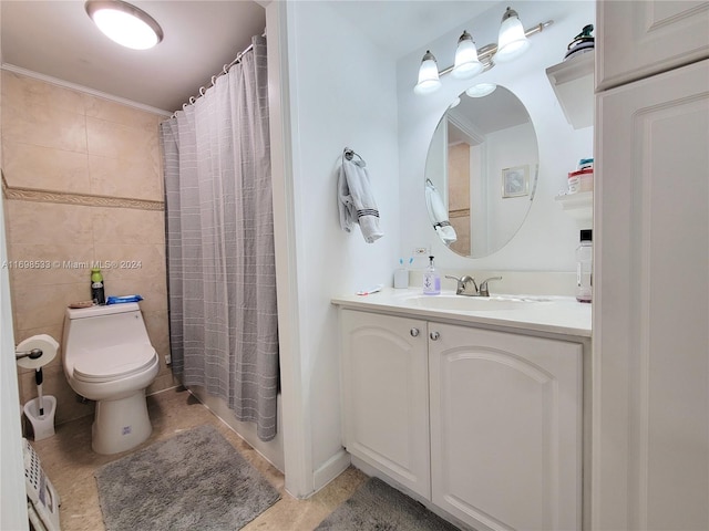 bathroom featuring tile patterned floors, crown molding, toilet, vanity, and tile walls