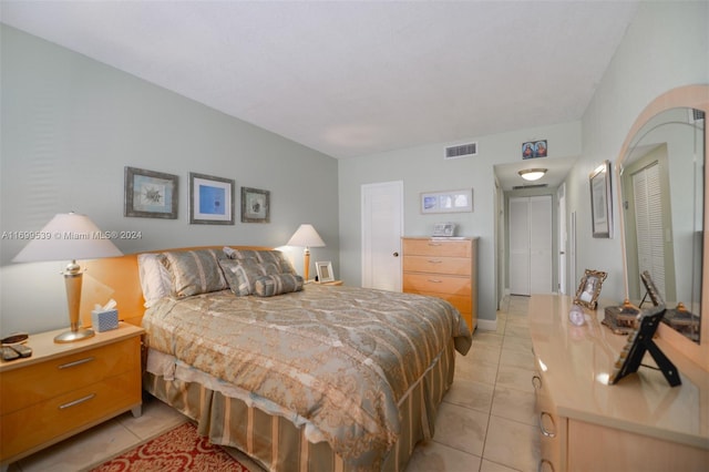 bedroom featuring light tile patterned floors