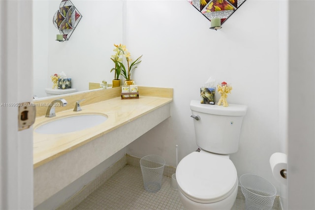 bathroom with tile patterned floors, toilet, and sink