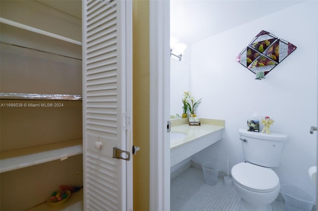 bathroom with tile patterned floors and toilet