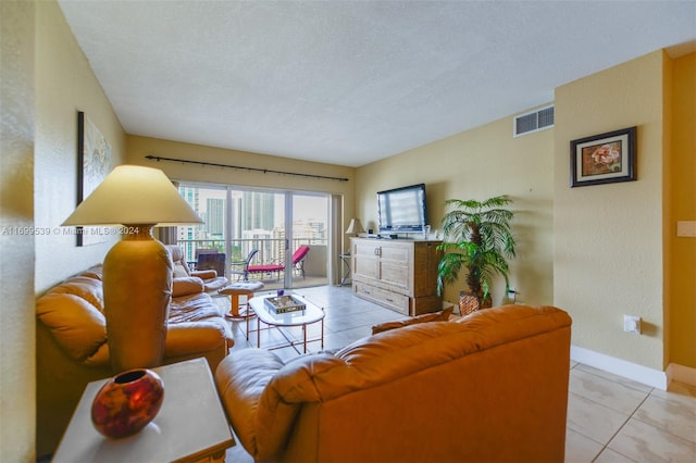 tiled living room with a textured ceiling