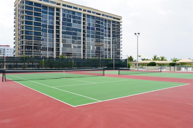 view of sport court featuring basketball hoop