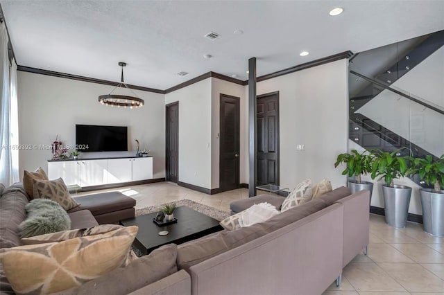 tiled living room featuring ornamental molding and an inviting chandelier