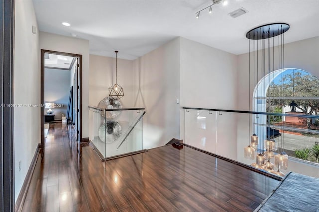 hall with dark hardwood / wood-style floors