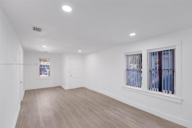 spare room featuring light hardwood / wood-style floors