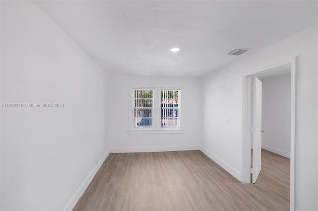 unfurnished room featuring light hardwood / wood-style flooring