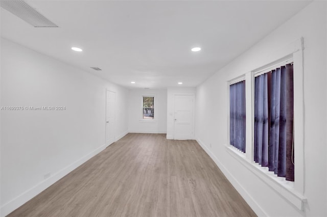 unfurnished room featuring light hardwood / wood-style floors