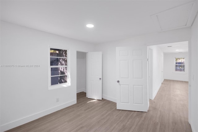 unfurnished bedroom featuring light wood-type flooring