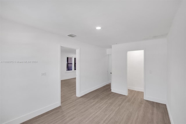 unfurnished room featuring light wood-type flooring