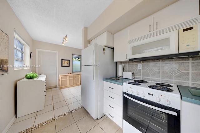 kitchen with white cabinetry, a textured ceiling, white appliances, decorative backsplash, and light tile patterned flooring