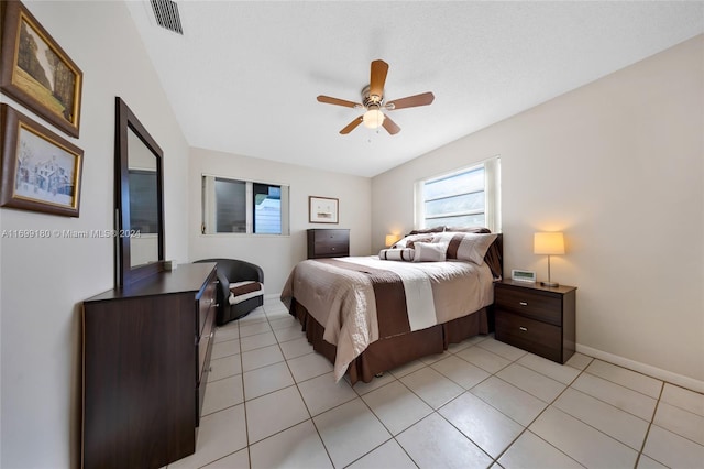 tiled bedroom with ceiling fan