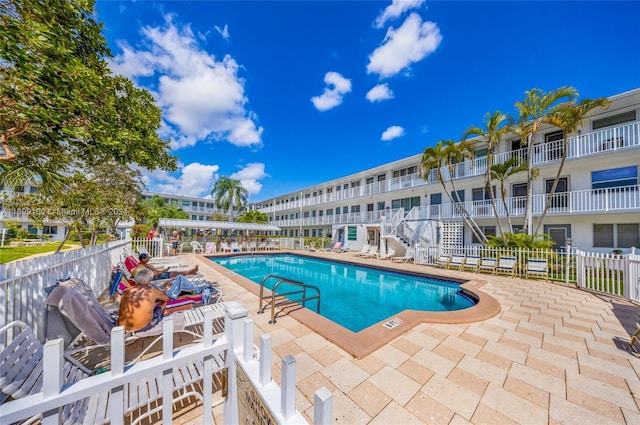 view of swimming pool featuring a patio area