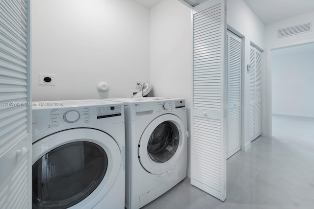 laundry room featuring laundry area, washer and dryer, and visible vents