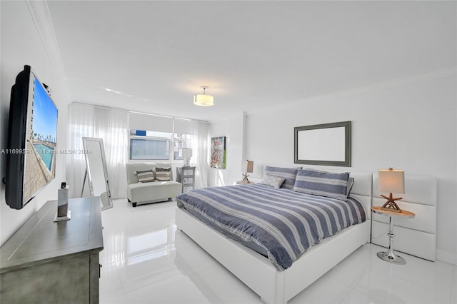 bedroom with crown molding and light tile patterned floors