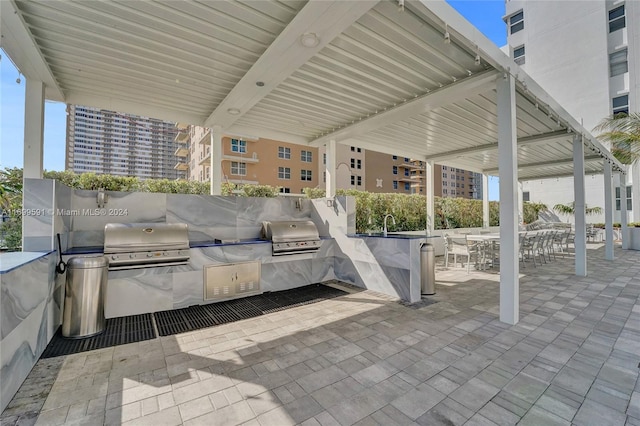 view of patio / terrace featuring a grill and exterior kitchen