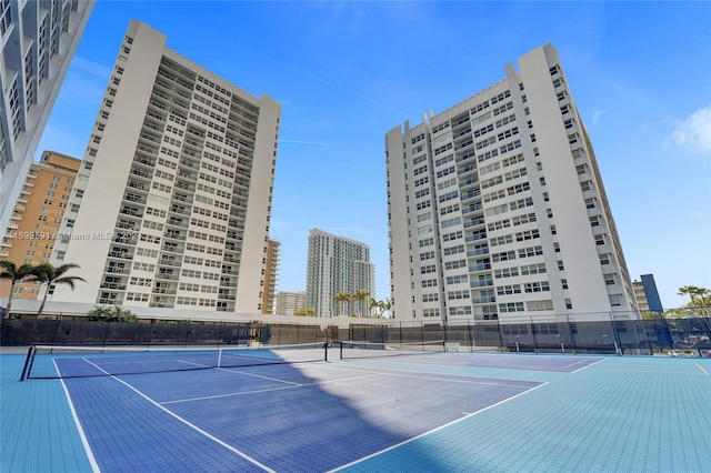 view of tennis court featuring basketball court