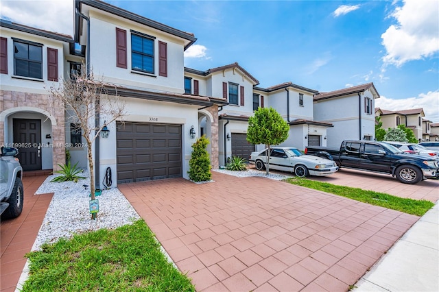 multi unit property featuring a garage