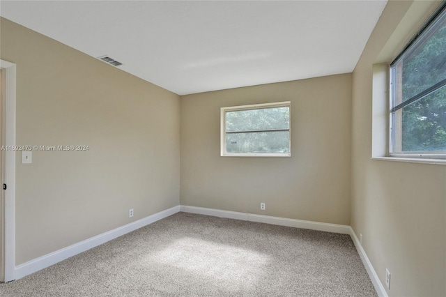 spare room featuring carpet flooring